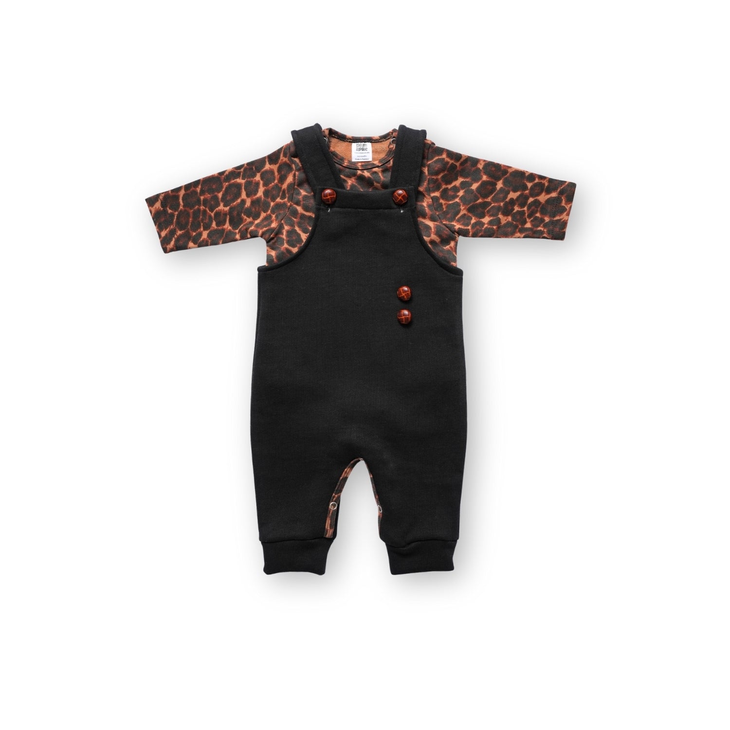 Black baby overalls worn over a long-sleeve leopard print bodysuit, Infant or toddler outfit set featuring black overalls with wooden buttons and a brown leopard print top