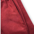 Close-up of a red fabric texture on a white background