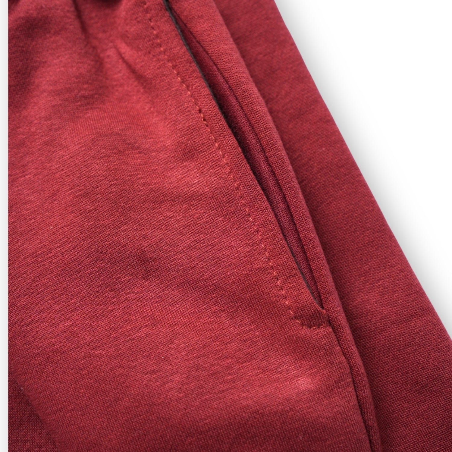 Close-up of a red fabric texture on a white background