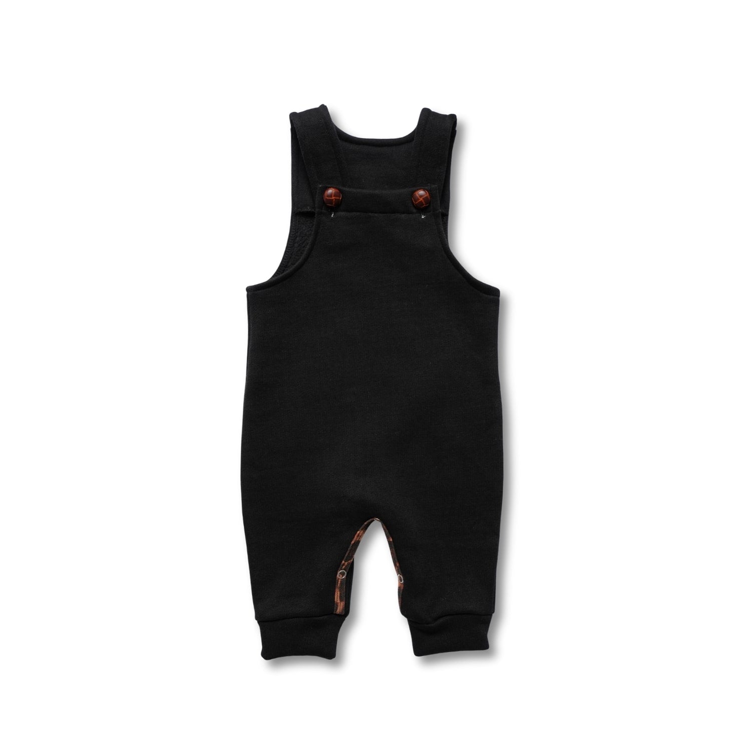 Black baby overalls or dungarees with dark wooden buttons and cuffed ankles