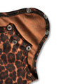 Detail shot of a brown and black leopard print baby bodysuit with snap fasteners at the crotch
