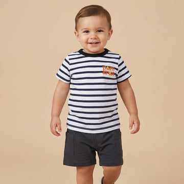 A model of Palm and Pale weared a stripe shirt and balck short by sowing the signature of baby clothing brand palm and pale for 1 year baby to 5 year baby boy in summer cotton pk fabric.
