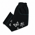 Black butterfly print kids denim pants folded to show waistband detail, teal stitching, and white butterfly graphic at hem