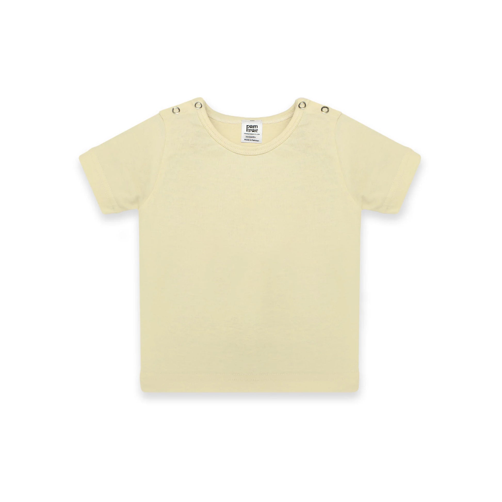 Newborn baby outfit featuring a soft pastel yellow T-shirt with snap buttons on the shoulders. The design highlights comfort and breathability, perfect for warm days. The background includes playful doodles,' and branding from Palm and Pale, emphasizing 'Sunny styles for little smiles.'