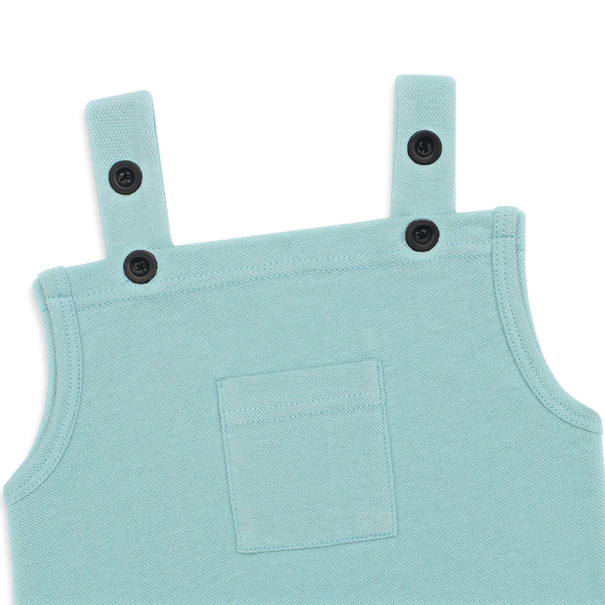 Newborn baby romper 0 months to 24 months and pocket on the front side
A pastel blue newborn romper with button-on-shoulder straps and front pockets, displayed against a light background with orange and green design elements. The text highlights features like 'Button on Shoulder,' 'Pockets,' and 'New Arrivals.' The brand name 'Palm and Pale' and the website 'palmandpale.com' are also visible. The tagline reads 'Sunny styles for little smiles.'